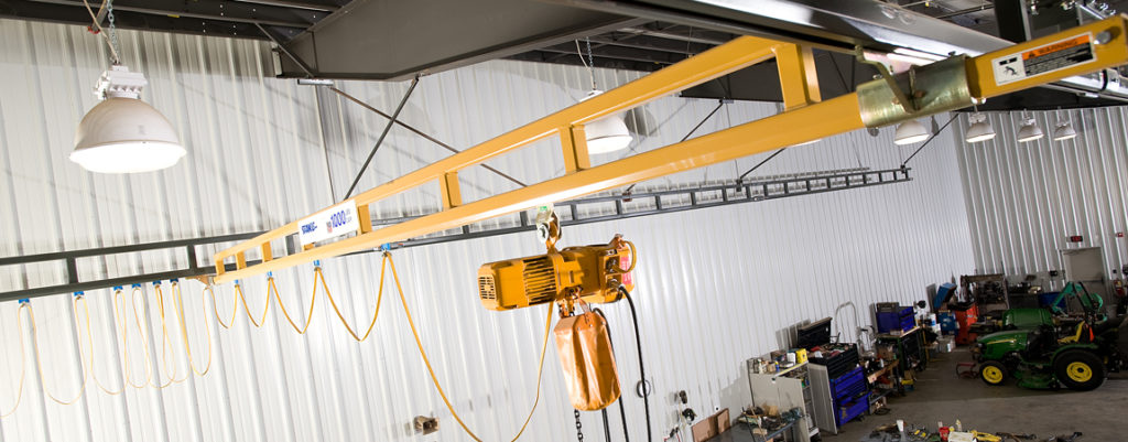 Pendant light on a workstation bridge crane